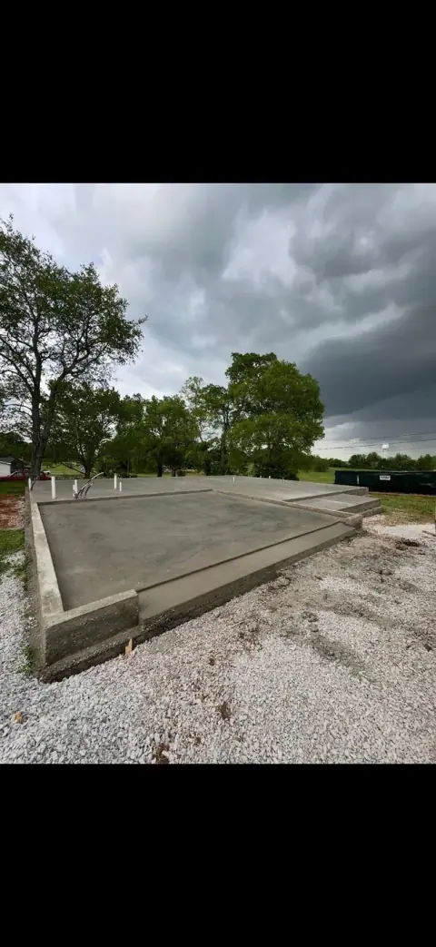 Finished concrete pad on a gravel base, ready for a patio