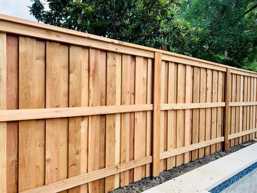 Board-on-board cedar privacy fence along a property line, fence work by our general contractor La Vergne TN crew