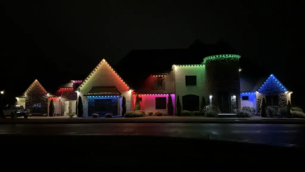 Home lit with red, green, blue and purple color changing roofline lighting